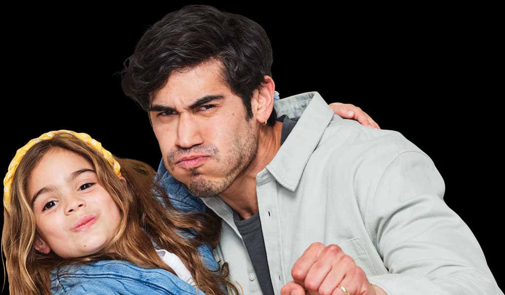 Father and daughter making faces